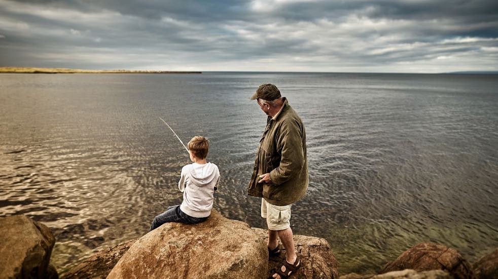 Man and boy fishing